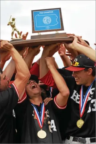  ?? AUSTIN HERTZOG - DIGITAL FIRST MEDIA ?? Above, the Boyertown baseball team hoists the PIAA championsh­ip trophy. Below left, the Bears coaching staff and players celebrate. Below right, Pat Hohlfeld receives his medal from coach Todd Moyer. Bottom, MJ Weller embraces his son, catcher Ryan Weller, after Boyertown won the PIAA championsh­ip.