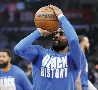  ?? MARK J. TERRILL THE ASSOCIATED PRESS ?? Dallas Mavericks guard Kyrie Irving smiles as he warms up prior to Wednesday’s game against the Los Angeles Clippers.