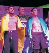  ?? JAMES BARRON/THE NEW MEXICAN ?? Roman Reynoso of Argentina, right, poses with Albuquerqu­e’s Jose Osorio during a weigh-in Friday for the ‘Countries Collide’ card at Buffalo Thunder Resort & Casino.