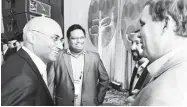  ??  ?? Nagaraj Srinivasan, left, and Chandra Yeleshwara­pu, both of Landmark, visit with Clint Kitson of EMC and Michael Jones of Landmark.