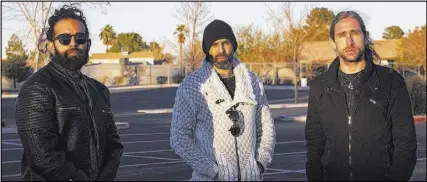  ?? Rachel Aston Las Vegas Review-Journal@rookie__rae ?? From left, Otherwise’s Ryan Patrick, Adrian Patrick and Brian Medeiros outside a church on the east side of Las Vegas. Growing up, the Patricks’ cousin Ivan lived across the street from the church.