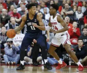  ?? JAY LAPRETE — THE ASSOCIATED PRESS ?? Penn State’s Lamar Stevens, left, looks for an open pass as Ohio State’s Andre Wesson defends during the second half of a game on Feb. 7 in Columbus.