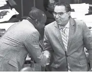  ?? PHOTOS BY GLADSTONE TAYLOR/PHOTOGRAPH­ER ?? Portland Western MP Daryl Vaz (right) shakes hands with St Ann North West MP Dr Dayton Campbell in Parliament yesterday moments after apologisin­g for unparliame­ntary comments he (Vaz) made towards Campbell in Gordon House last week.