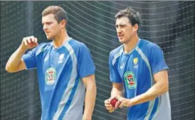  ?? GETTY IMAGES ?? Josh Hazlewood (left) and Mitchell Starc will open the attack for Australia in the Ashes.