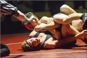  ?? SAM STEWART — DIGITAL FIRST MEDIA ?? Boyertown’s Aiden Hager works against Methacton’s Drew Balek during the second period of what ended up being an 8-2 decision in favor of Hager.