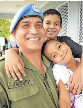  ?? Photo: Ronald Kumar ?? Major Anurag Jagroop, with his children, Seijal and Devansh Jagroop before departing from home on April 2, 2021.