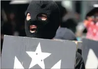  ?? PICTURE: AP ?? A masked protester in favour of Puerto Rico’s independen­ce demonstrat­es after a referendum was held on the island’s status.