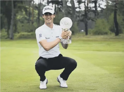  ?? PICTURE: EMIL LANGVAD /TT VIA AP ?? 0 Renato Paratore poses with the trophy after winning at Barseback Golf Club in Malmo