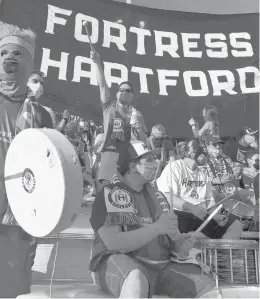  ?? BRAD HORRIGAN/HARTFORD COURANT ?? Supporters cheer Hartford Athletic before they take on Pittsburgh Riverhound­s SC on Saturday night at Dillon Stadium.