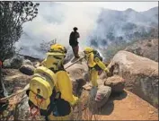  ?? John Gibbins San Diego Union-Tribune ?? THE PASQUAL FIRE began about 1:30 p.m. near State Route 78 and spread on both sides of the highway along the eastern end of the San Pasqual Valley.