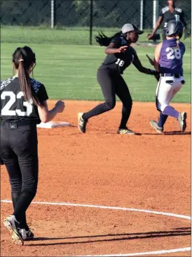  ??  ?? Ridgeland pitcher Hailey Carroll watches as shortstop Haley Sandridge tags out Gilmer’s Marie Goswick on a stolen base attempt. The Lady Panthers won the game, 10-2. (Messenger photo/Scott Herpst)