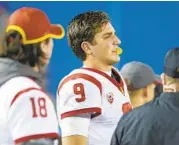  ?? CHADD CADY ?? USC quarterbac­k Kedon Slovis looks on after he injured his arm in the second half against Iowa.