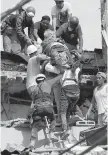  ?? REBECCA BLACKWELL, AP ?? An injured man is pulled out of a building that collapsed in the Roma Norte neighbourh­ood of Mexico City.