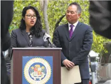  ?? Michael Macor / The Chronicle ?? Assemblyma­n Phil Ting listens to Lenine Umali of Compass Family Services during the announceme­nt of his legislatio­n.