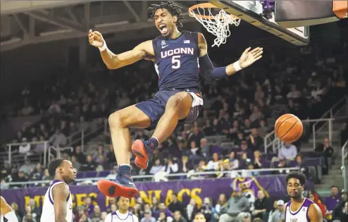  ?? Greg Thompson / Icon Sportswire via Getty Images ?? UConn’s Isaiah Whaley dunks against East Carolina during a February game at Williams Arena at Minges Coliseum in Greenville, NC. Whaley is determined to build off his strong finish last season.