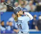  ?? MARK BLINCH – GETTY IMAGES ?? Bo Bichette of the Blue Jays hits a grand slam during the eighth inning to break a 2-2 tie against the Red Sox on Monday night at the Rogers Centre in Toronto, Ontario, Canada.