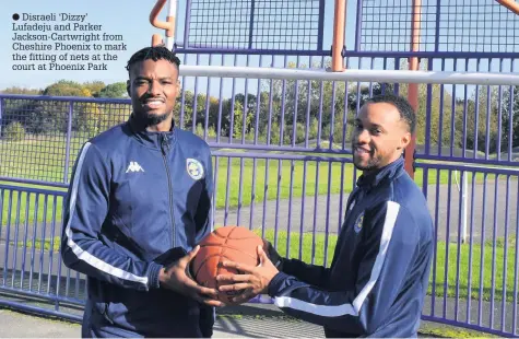  ??  ?? Disraeli ‘Dizzy’ Lufadeju and Parker Jackson-Cartwright from Cheshire Phoenix to mark the fitting of nets at the court at Phoenix Park