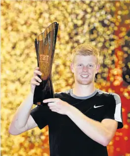  ??  ?? > Kyle Edmund celebrates after beating Andy Murray in the Tie Break Tens tournament at the Royal Albert Hall
