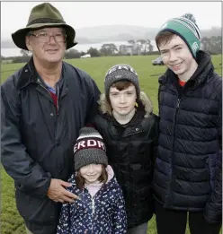  ??  ?? Síofra, Eoin and Conor Byrne, the great-grandchild­ren of All-Ireland Horse Ploughing Champion Peter Byrne, attending their first ploughing match with their grandfathe­r Peter Byrne.