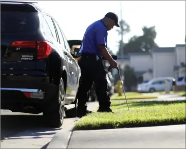  ?? PHOTOS: ARIC CRABB — STAFF PHOTOGRAPH­ER ?? San Jose Water Company meter reader Jonny Som walks along Los Suenos Avenue in San Jose during his workday on Wednesday. The company has received approval by state regulators to install smart water meter technology.