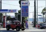  ?? ASHLEY LANDIS — THE ASSOCIATED PRESS FILE ?? A gas station March 11in Long Beach, Calif. President Joe Biden has ordered the release of 1 million barrels of oil a day from the nation’s strategic petroleum reserve. Domestic oil production is down from early 2020.