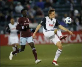  ?? ASSOCIATED PRESS ?? Philadelph­ia Union defender Jack Elliott and Colorado Rapids forward Dominique Badji in the first half of an Major League Soccer match on March 31 in Commerce City, Colo.