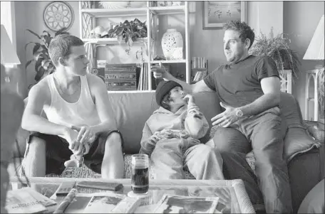  ?? Photograph­s by Tobin Yelland ?? “MID90S” costars Lucas Hedges, from left, and Sunny Suljic confer with first-time director Jonah Hill, who also wrote the screenplay.