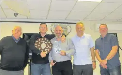  ??  ?? Bleddyn Richards receives his Welsh Reserve League POY & PPOY award from special guest Mike Casey & Reserve team management Steve Jenkins, Richard Evans and Tudor Jenkins