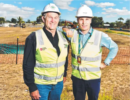  ?? Picture: ALIX SWEENEY ?? WORK STARTS: Shamrock operations manager NQ Clinton Huff with Townsville Airport chief operating officer Kevin Gill on the constructi­on site of Meenan St and John Melton Black Drive connection.