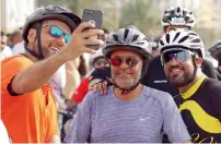  ??  ?? Three participan­ts take a selfie after completing the charity race.