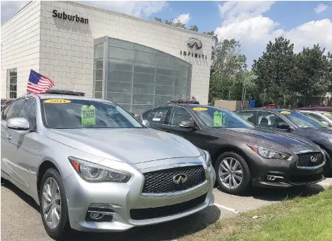  ?? TOM KRISHER/THE ASSOCIATED PRESS ?? Like many companies that pumped up their sales with extensive leasing during the past few years, Infiniti dealers now face a hefty supply of nice, low-mileage used Q50s at a time when most people want SUVs.