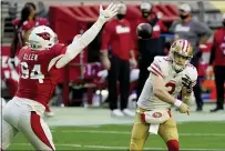  ??  ?? San Francisco 49ers quarterbac­k C.J. Beathard (3) looks to pass as Cardinals defensive end Zach Allen (94) defends during the first half on Saturday in Glendale, Ariz.