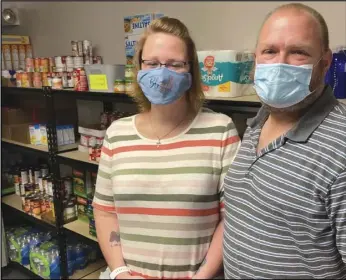  ?? Photo provided ?? Jennifer and Tim Overley, members of New Community Church, located at 1025 Greenville Road, are gearing up for this week’s food distributi­on at the church.