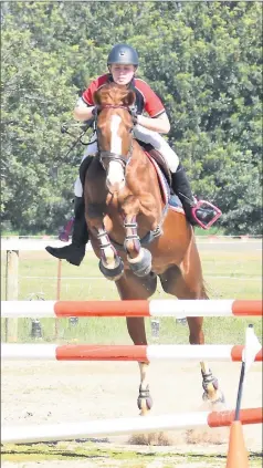  ??  ?? Jump show . . . Amber Cavanagh from the Border and District Showjumpin­g Club gets plenty of height.