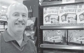  ?? [FAISAL ALI / THE OBSERVER] ?? Doug Pagett of the Foodland supermarke­t in Elmira has seen a shift in demand for Halloween-related treats.