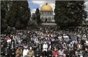  ?? MAHMOUD ILLEAN/AP ?? Worshipers pray Friday at Al-Aqsa Mosque compound in the Old City of Jerusalem during the Muslim holy month of Ramadan, which began March 10. Mediators hoped for a cease-fire before then.