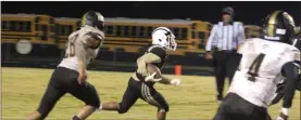  ?? Kevin Myrick ?? Rockmart’s Mehki Floyd comes up with a 35-yard reception for a first down in the fourth quarter during a 24-7 playoff win.