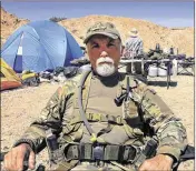  ?? KEN RITTER / ASSOCIATED PRESS 2014 ?? Gerald DeLemus was one of several self-described militia members camping on Cliven Bundy’s ranch near Bunkervill­e, Nev.
