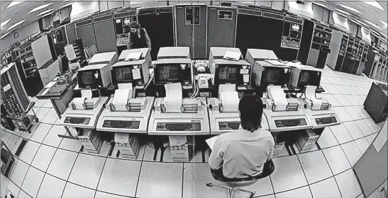  ?? [DISPATCH FILE PHOTO] ?? This fisheye view shows CompuServe’s mainframes and control terminals in 1984.