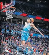  ?? [SARAH PHIPPS/THE OKLAHOMAN] ?? Oklahoma City's Terrance Ferguson goes up for a dunk during Sunday night's game against the Memphis Grizzlies at Chesapeake Energy Arena.