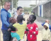  ?? ?? Robert Hanna pictured in Nairobi, with students from the Brydges Centre School.