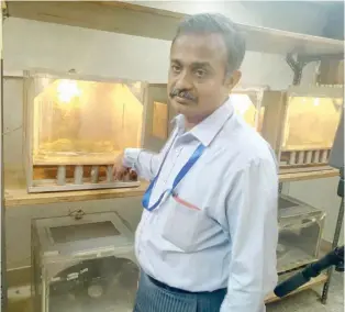  ??  ?? Dr Sevgan Subramanin explaining the breeding processes in the locust laboratory