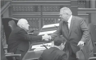  ?? STEVE RUSSELL TORONTO STAR ?? Premier Doug Ford, right, addresses Jim Wilson, MPP from Simcoe-Grey, in the legislatur­e on Tuesday. Wilson was ejected from caucus and cabinet last fall after a sex scandal involving a male PC staffer.