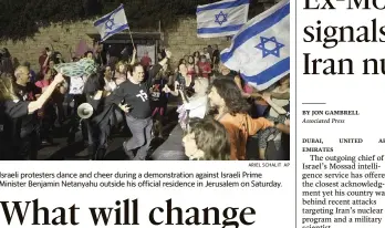  ?? ARIEL SCHALIT AP ?? Israeli protesters dance and cheer during a demonstrat­ion against Israeli Prime
Minister Benjamin Netanyahu outside his official residence in Jerusalem on Saturday.