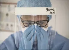  ??  ?? Medical staff - including the nurses pictured here in intensive care at the Royal Alexandra Hospital, Paisley – look after coronaviru­s patients as ministers discuss how to respond to the financial fallout