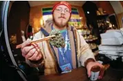  ?? Associated Press file ?? The Colorado legislatur­e may allow recreation­al pot growers to instantly reclassify their product as medicinal if federal law or enforcemen­t changes.