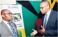  ?? RUDOLPH BROWN/PHOTOGRAPH­ER ?? Courtney Cole (left), chief technical director in the Ministry of Industry, Commerce, Agricultur­e and Fisheries, in dialogue with Sylburn Thomas, CEO of Agro-Investment Corporatio­n, at the Jampro agricultur­al informatio­n forum in Kingston on Tuesday,...