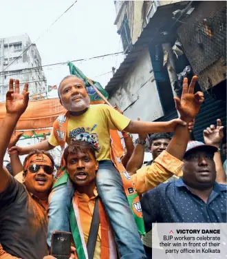  ??  ?? VICTORY DANCE BJP workers celebrate their win in front of their party office in Kolkata