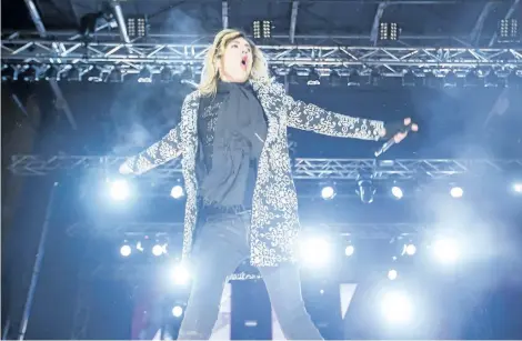  ?? BOB TYMCZYSZYN/STANDARD STAFF ?? Marianas Trench lead singer Josh Ramsay performs as thousands of people brave frigid weather conditions to ring in the new year at Queen Victoria Park in Niagara Falls Monday.