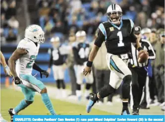  ??  ?? CHARLOTTE: Carolina Panthers’ Cam Newton (1) runs past Miami Dolphins’ Xavien Howard (25) in the second half of an NFL football game in Charlotte. — AP